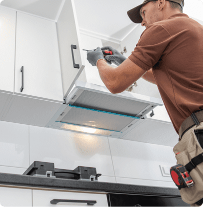 Man installing kitchen cabinet