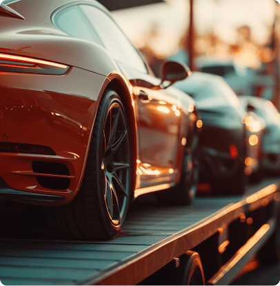 Luxury cars being transported on truck