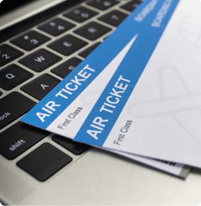 Boarding passes resting on laptop